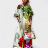 Skylar - Maxikleed met bloemenprint, schuin decolleté en puffmouwen