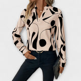 Edith - Elegante langärmelige blouse met spitse halslijn