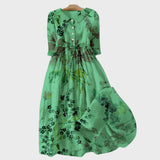 Groene jurk met geschaduwde bloemen