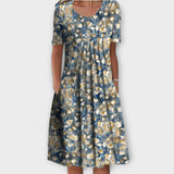 Emelie | Zomerjurk met wilde bloemenprint en plooien aan de voorkant