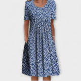 Emelie | Zomerjurk met wilde bloemenprint en plooien aan de voorkant