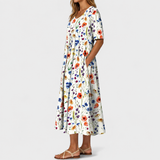 Emelie | Zomerjurk met wilde bloemenprint en plooien aan de voorkant