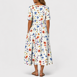 Emelie | Zomerjurk met wilde bloemenprint en plooien aan de voorkant