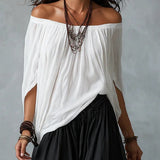 Witte off-shoulder ensemble met flare broek in lantaanstijl