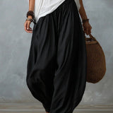 Witte off-shoulder ensemble met flare broek in lantaanstijl