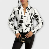 Edith - Elegante langärmelige blouse met spitse halslijn