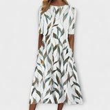 Adelina | Jurk met bloemen takken-print en A-lijn